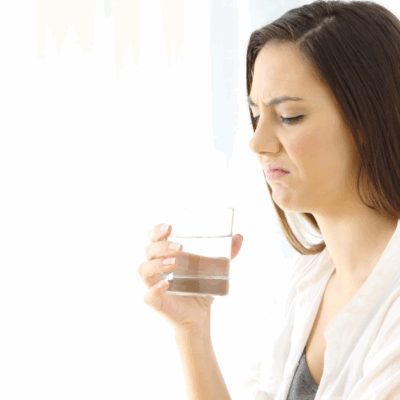 woman with glass of problem water