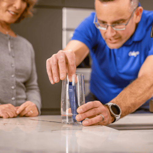 Culligan man testing water in home